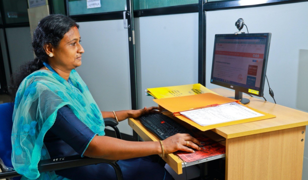 A woman works at a computer